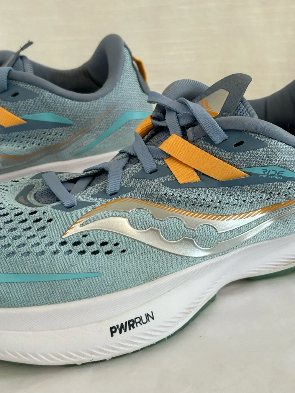 Saucony Ride 15 Women's Light Blue Athletic Sneakers with Yellow Accents